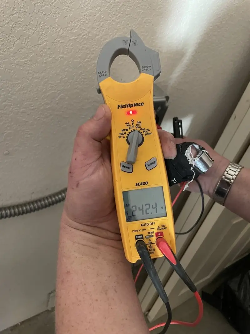 Voltage testing with clamp meter during Generator Installation in Estes Park